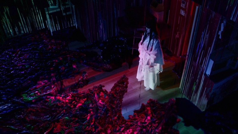 Takako Matsu as Kotoko, surrounded by evil blood in It Comes