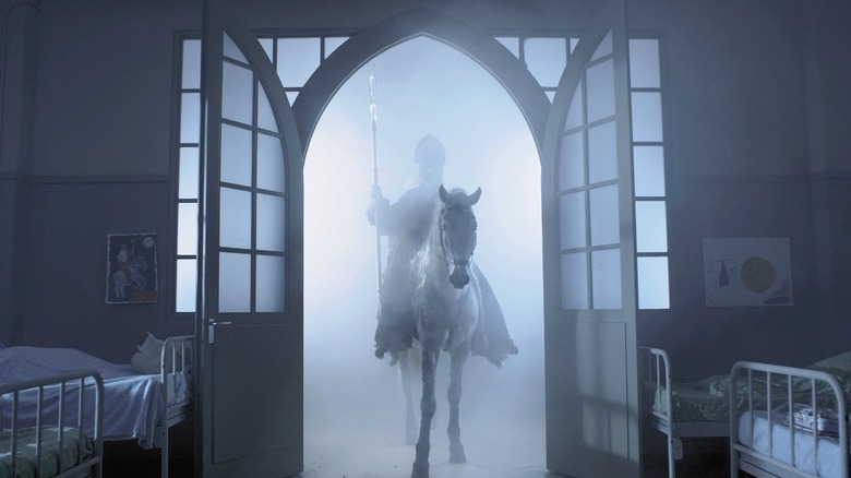 Huub Stapel as St. Niklas, riding into an orphanage in Saint