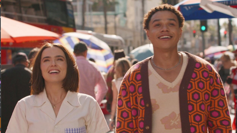 Gail Daughtry (Zoey Deutch) and Otto (Miles Gutierrez-Riley) smile in Los Angeles in Gail Daughtry and the Celebrity Sex Pass