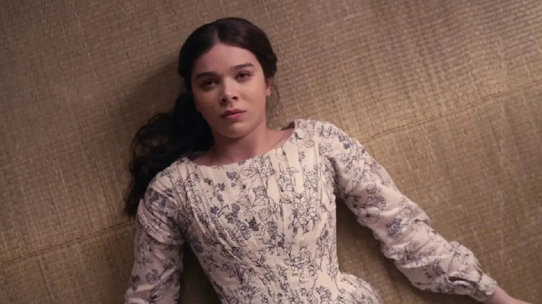 Emily Dickinson (Hailee Steinfeld) lays forlornly on the floor in Dickinson