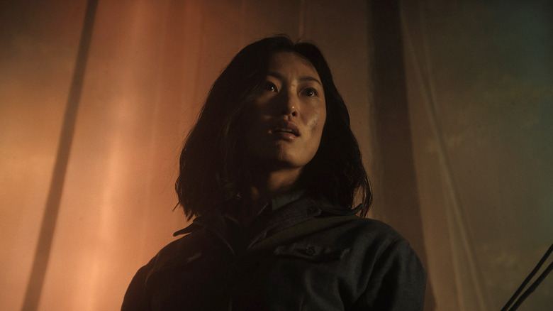 Keiko (Mari Yamamoto) stands before a portal in Monarch: Legacy of Monsters