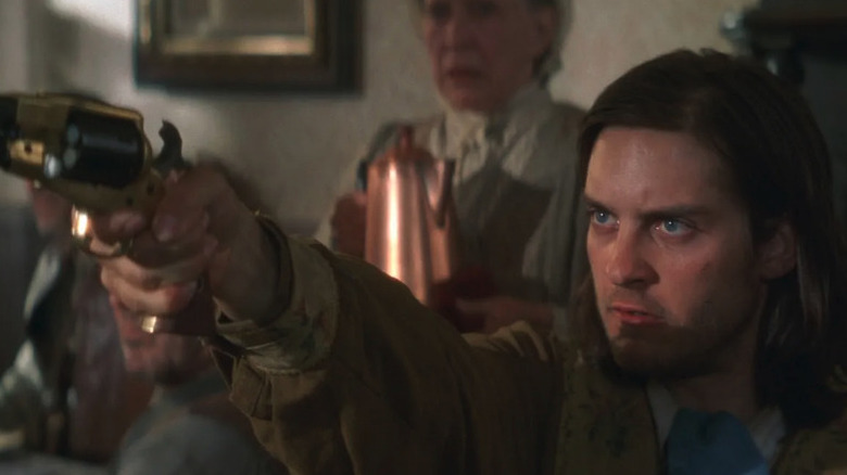 Jake Roedel (Tobey Maguire) points a gun in a diner in Ride with the Devil