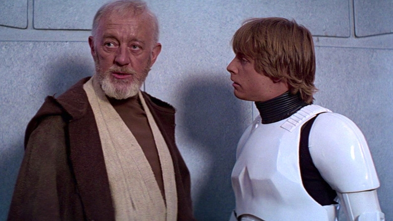 Alec Guinness as Obi-Wan Kenobi faces of against Dave Prowse's Darth Vader in "Star Wars"
