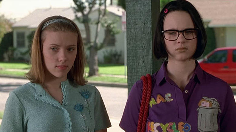Rebecca (Scarlett Johansson) and Enid (Thora Birch) stand uncomfortably on a front porch in Ghost World