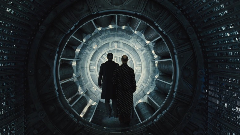 Characters look at the glowing engine in Snowpiercer