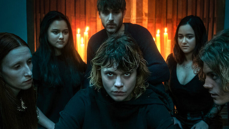 Cracow Monsters cast with candlelit background