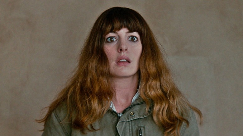 Gloria (Anne Hathaway) staring widely in Colossal