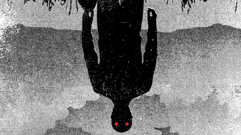 Symbolic representation of The Outsider as a horrific shadow on The Outsider original hardcover