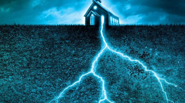 A glowing church, lit by blue lightning that goes down into the earth, on a paperback print of Revival