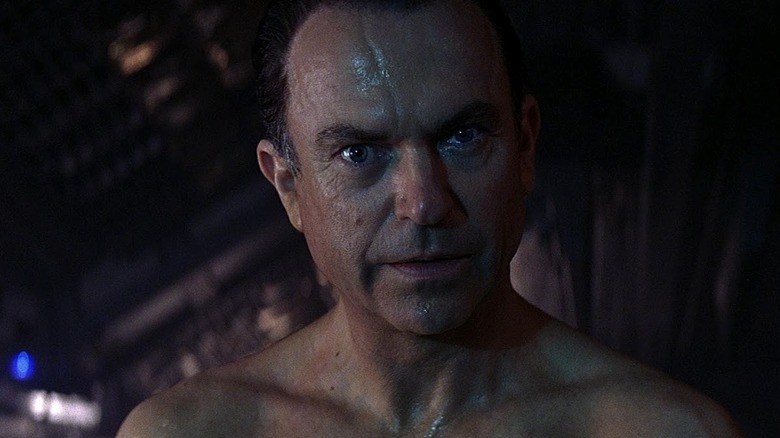 Sam Neill as Dr. William G. "Billy" Weir in Event Horizon, looking intently.