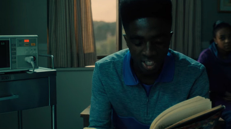 Lucas (Caleb McLaughlin) reading from The Talisman on Stranger Things