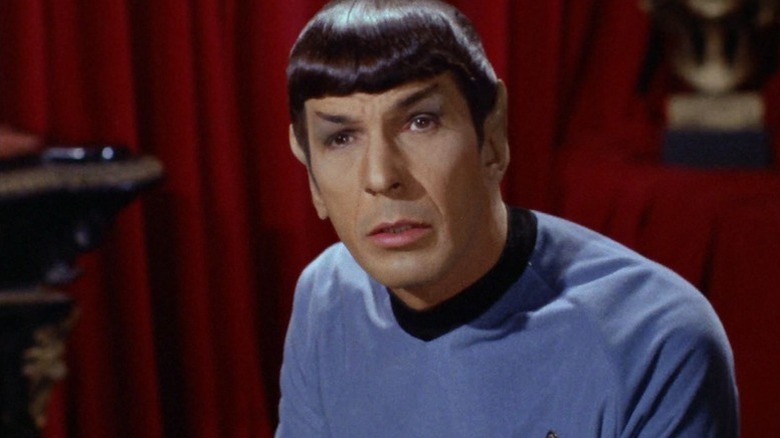 Spock (Leonard Nimoy) looks up with visible emotion on his face in Star Trek: The Original Series