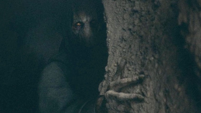 Darth Plagueis peers from a darkened cave in Star Wars: The Acolyte
