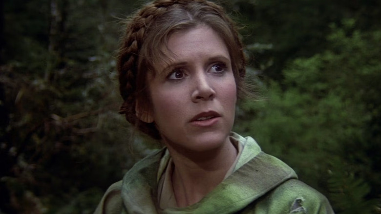 Leia Organa (Carrie Fisher) stands in a forest in Return of the Jedi