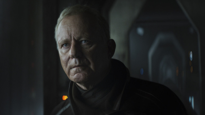 Luthen Rael (Stellan Skarsgård) peers in the shadows in Andor
