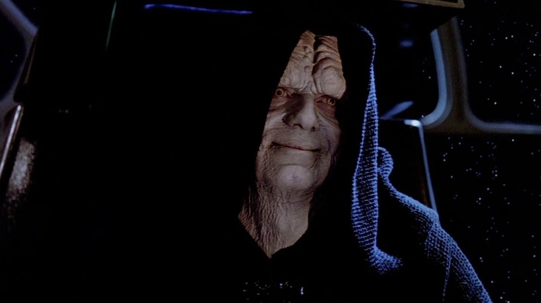 Sheev Palpatine (Ian McDiarmid) smirks from his throne in Return of the Jedi