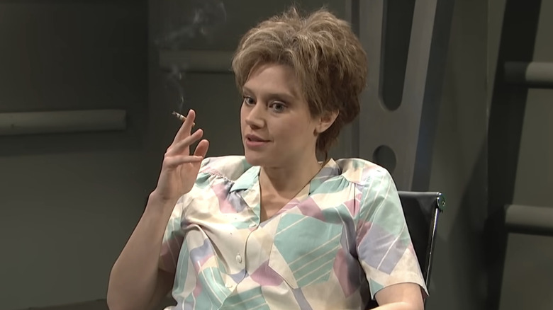 Kate McKinnon as Ms. Rafferty smoking in a Close Encounter sketch on SNL