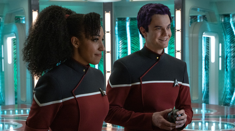 Beckett Mariner (Tawny Newsome) and Brad Boimler (Jack Quaid) stand in the transporter room in Star Trek: Strange New Worlds