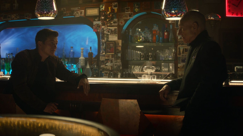 Jack Crusher (Ed Speleers) speaks with Jean-Luc Picard (Patrick Stewart) at a bar in Star Trek: Picard