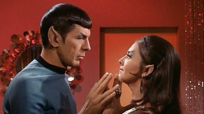 Spock (Leonard Nimoy) touches fingers with the Romulan commander (Joanne Linville) in Star Trek: The Original Series