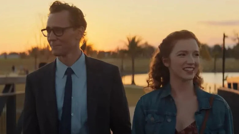 Chuck Krantz (Tom Hiddleston) and Sam Yarborough (Annalise Basso) smile together in the sunset in The Life of Chuck