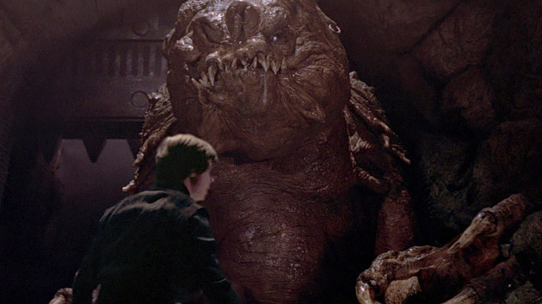 A Rancor advances on Luke Skywalker (Mark Hamill) in Return of the Jedi