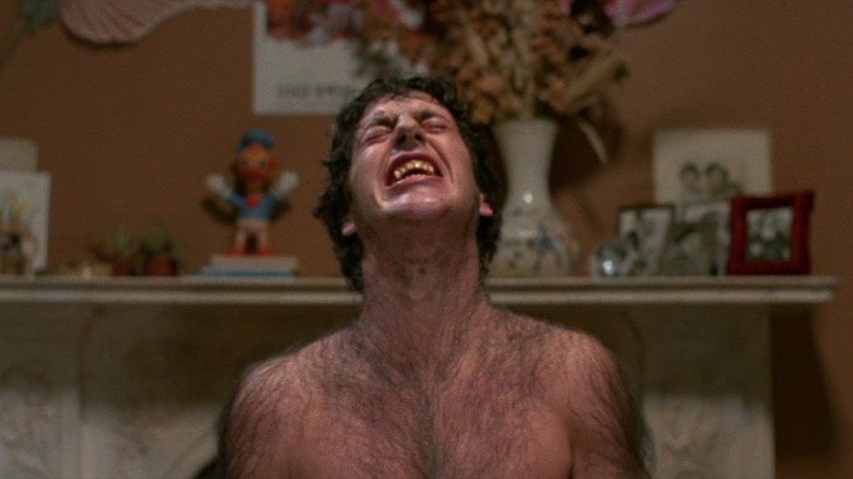 David Naughton as David Kessler in An American Werewolf in London, mid-transformation, hairy and contorted in pain