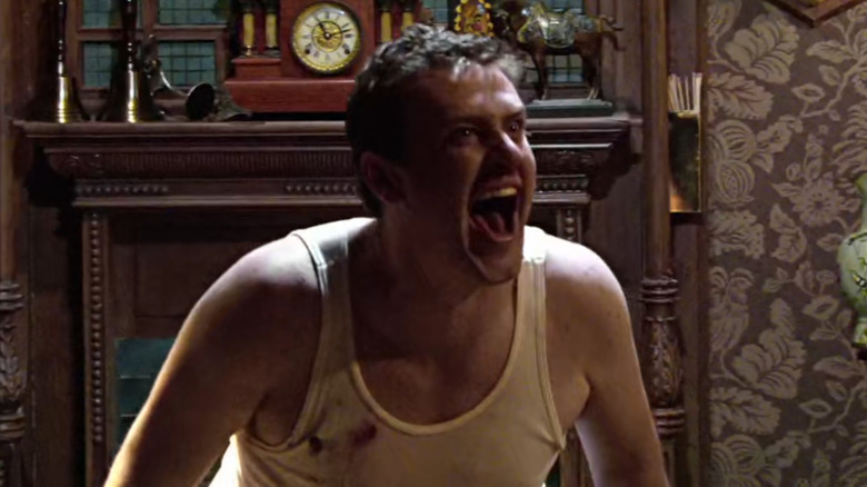 Marshall Erikson (Jason Segel) laughing maniacally while fighting his two older brothers in How I Met Your Mother