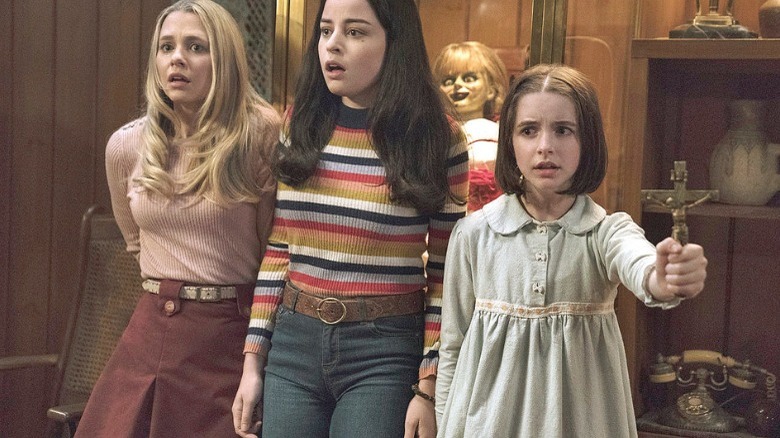 Annabelle Comes Home ward off demons with cross