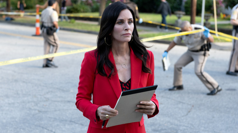 Scream 5's Gale Weathers investigating crime scene