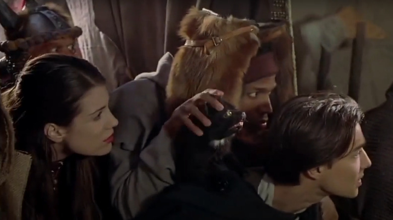 Marlon Waynes, Kristen Wilson, and Justin Whalin hiding 