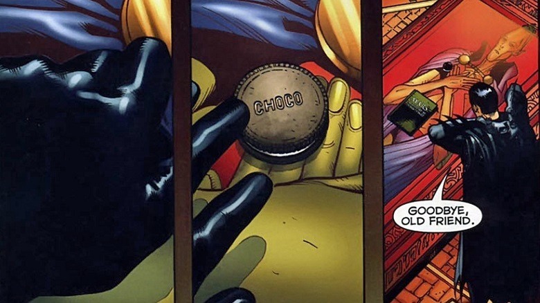Batman leaving a choco on Martian Manhunter's casket