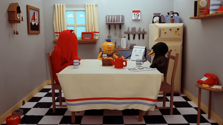 Red Guy, Yellow Guy, Sketchbook, and Duck sitting around a table on Don't Hug Me I'm Scared