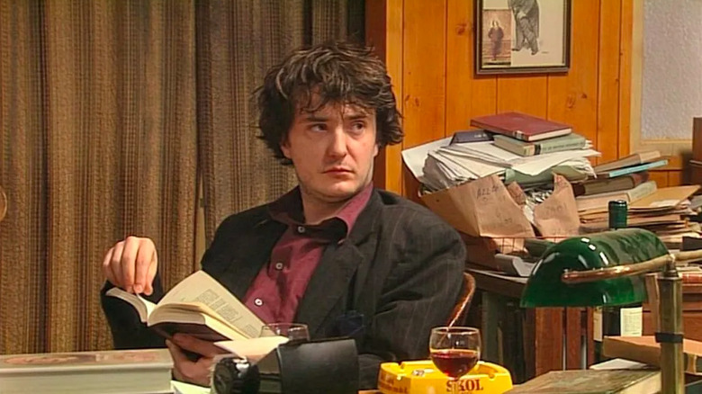 Bernard Black reading a book