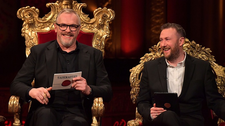 Greg Davies and Alex Horne sitting and laughing