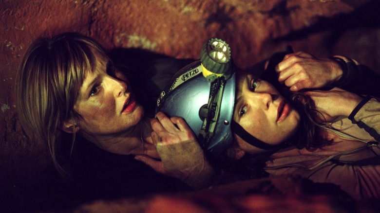 Two women in a cave