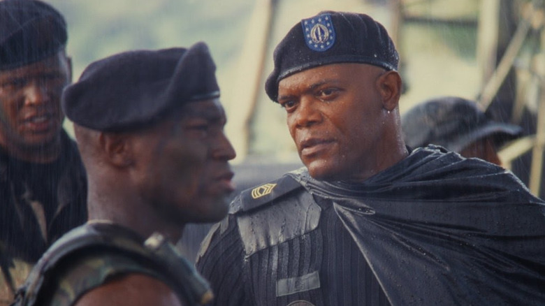 Samuel L. Jackson as Master Sergeant Nathan West looking at his soldiers in the rain in Basic