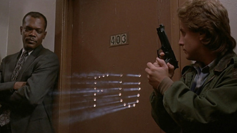 Samuel L. Jackson as Sgt. Wes Luger and Emilio Estevez as Sgt. Jack Colt in front of FU bullet door in Loaded Weapon 1