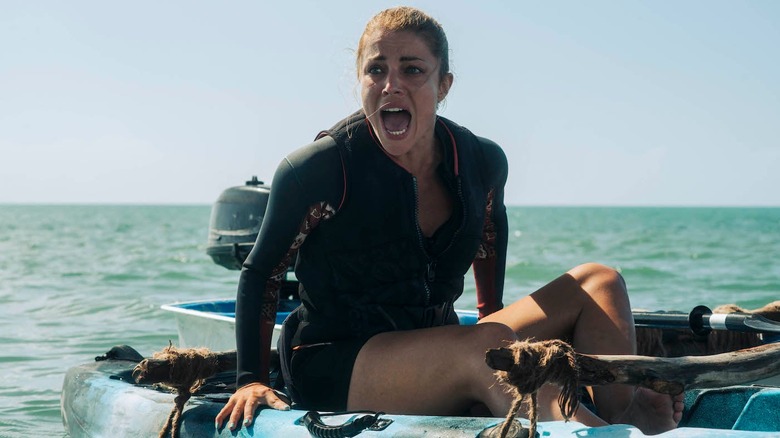 A young woman tries to escape on a boat