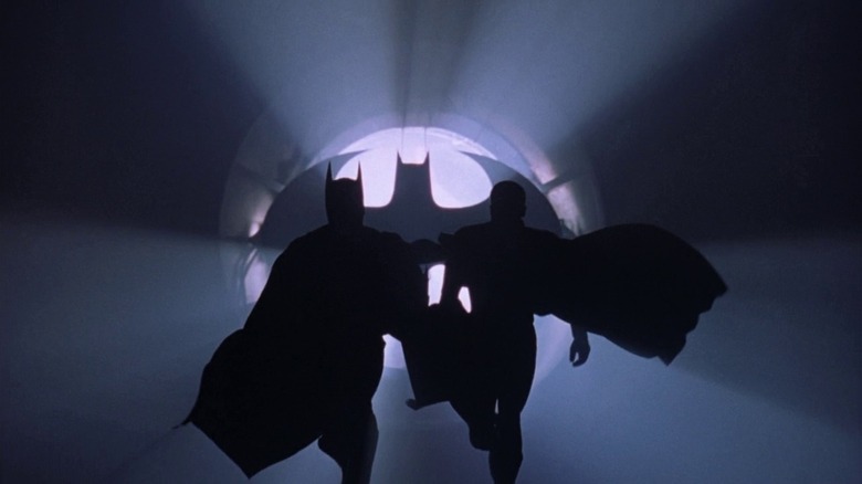 Batman (Val Kilmer) and Robin (Chris O'Donnell) running in Batman Forever