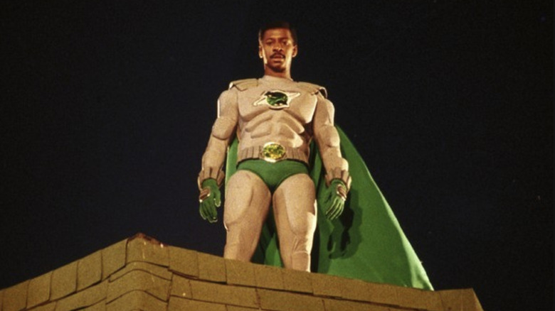 The Meteor Man (Robert Townsend) looks down from a building in The Meteor Man