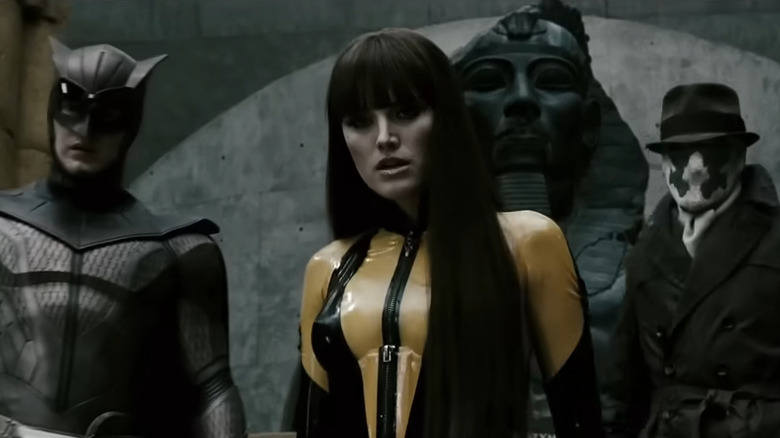 Nite Owl, Silk Spectre II, and Rorschach standing together in Watchmen