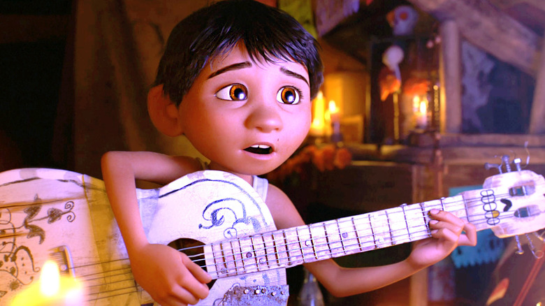 Miguel (Anthony Gonzalez) plays guitar and sings in Coco