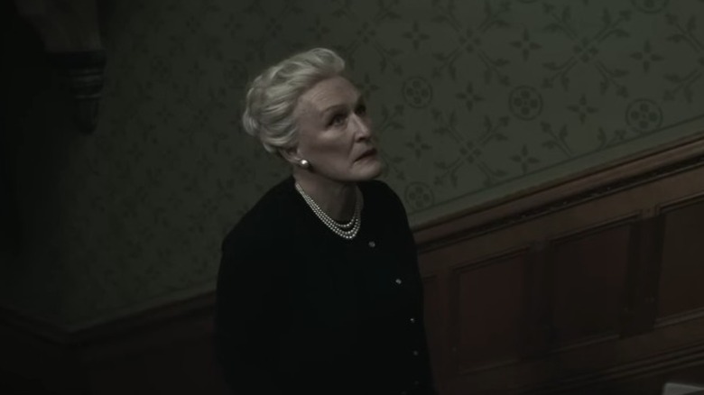 Glenn Close as Lady Edith de Haviland ascending a staircase in Crooked House