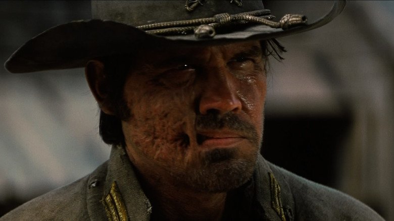 A close-up of Josh Brolin as Jonah Hex in Jonah Hex, complete with his steampunk cowboy hat and burn scar-adorned face.