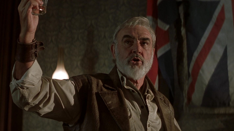 Sean Connery as Allan Quartermain in The League of Extraordinary Gentlemen, raising a shot glass up in the air.