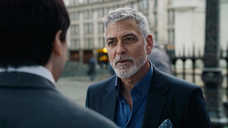 George Clooney's Bruce Wayne speaking to Ezra Miller's Barry Allen in The Flash