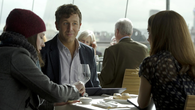 Chris O'Dowd as Richard sits between Kat Dennings as Darcy and Natalie Portman as Jane Foster in Thor: The Dark World