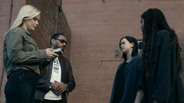 Annie January (Erin Moriarty) examines a device while Mother's Milk (Laz Alonso) speaks to Jordan Li (London Thor) and Marie Moreau (Jaz Sinclair) in The Boys