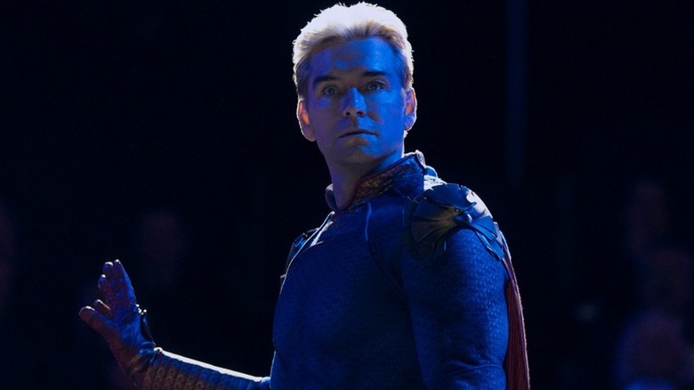 Homelander (Antony Starr) stands bathed in blue light in The Boys